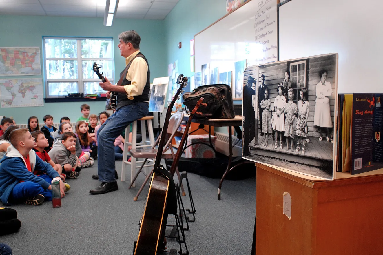 Jeff Warner at Garrison School performing folk songs for 4th grade students