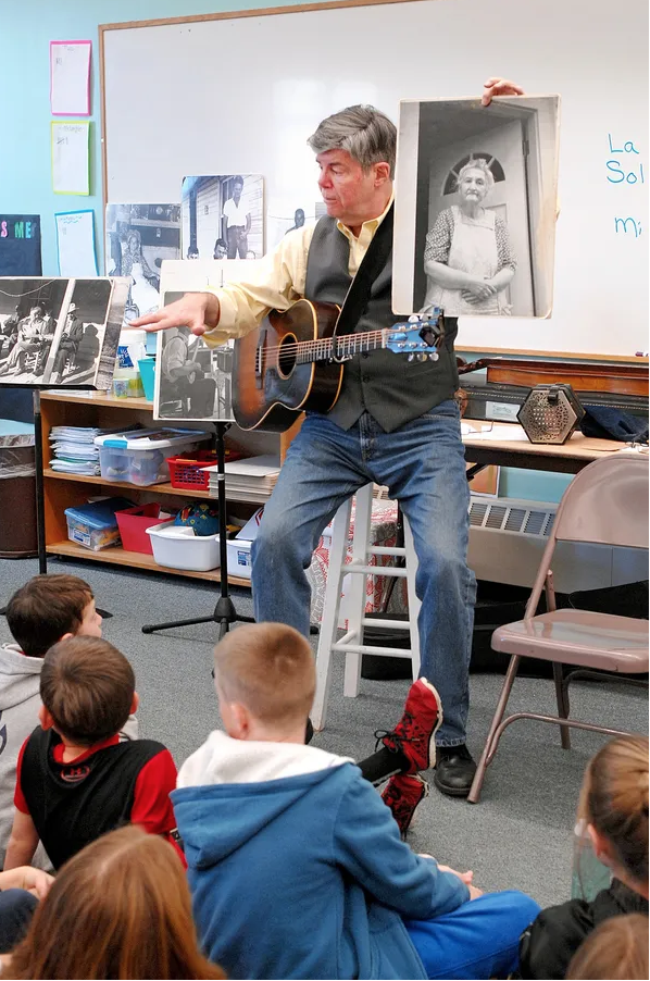 Jeff Warner at Garrison School performing folk songs for 4th grade students